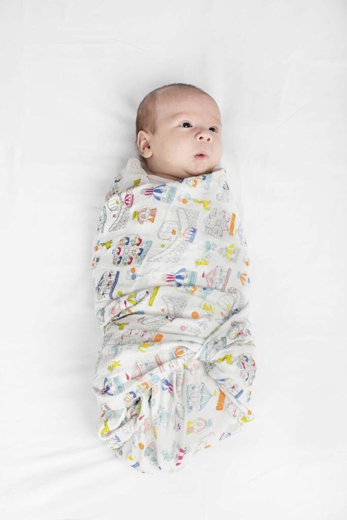Baby swaddled in a LouLou Lollipop blanket.