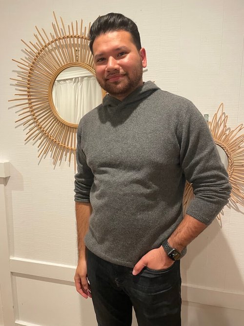 The writer's husband modeling the Recycled Cashmere Hoodie.