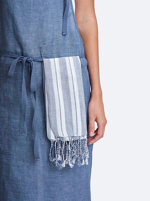 Cloth Napkins: Chan Luu's blue and white striped napkins are seen on a model's apron.