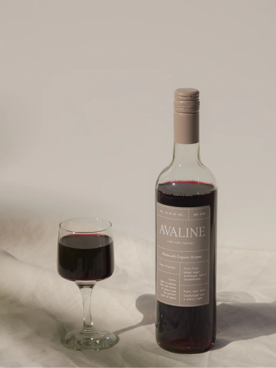 A bottle and glass of Avaline red wine. 