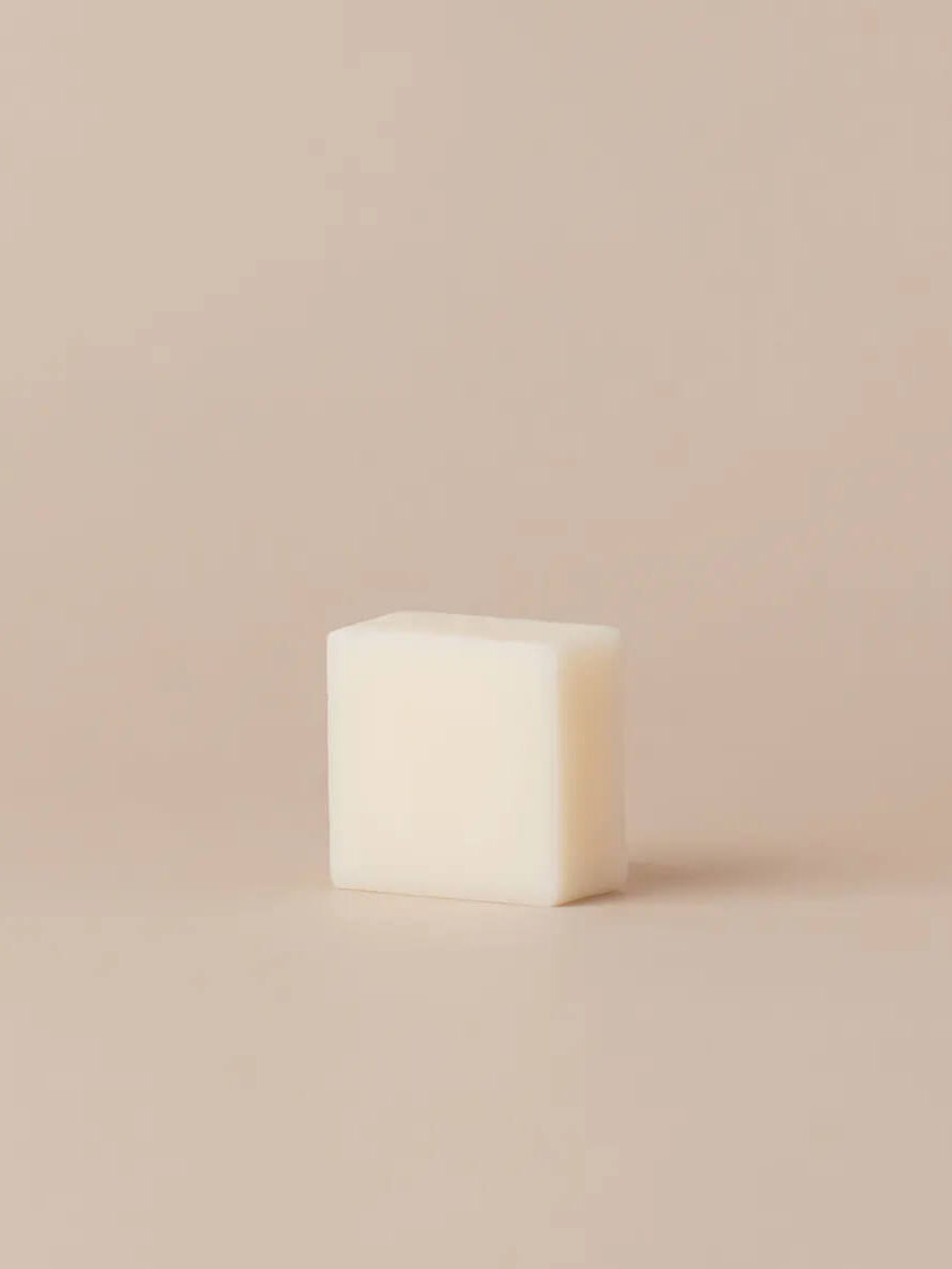 A white shampoo bar made by byHumankind. 