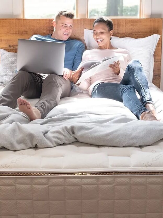 A couple lounges on their vegan mattress.