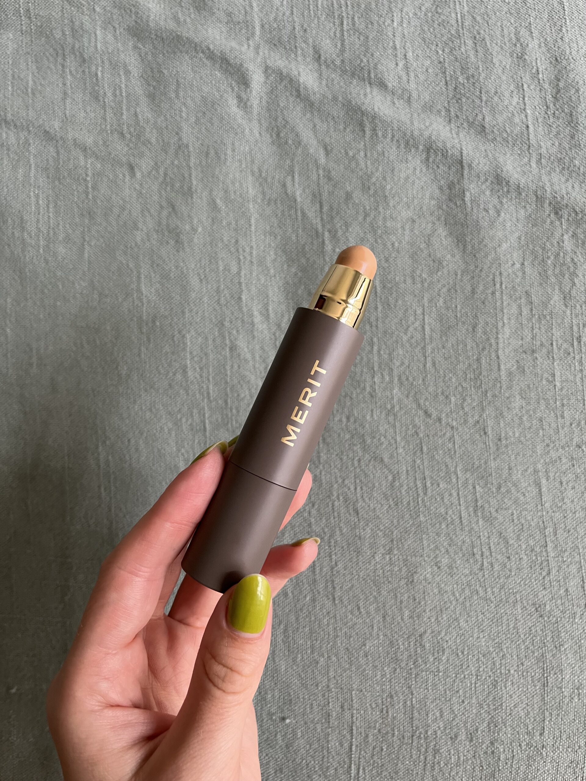 A stick of Merit foundation.