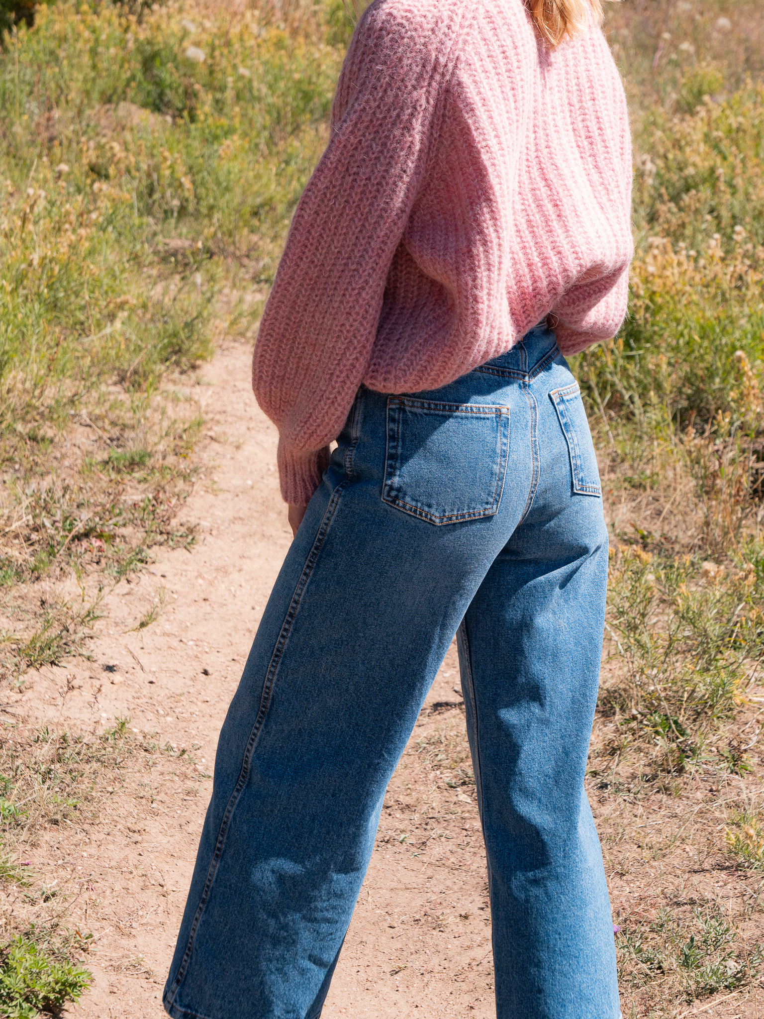The writer wearing the Sézane Emile Cardigan and Le Crop jeans. 