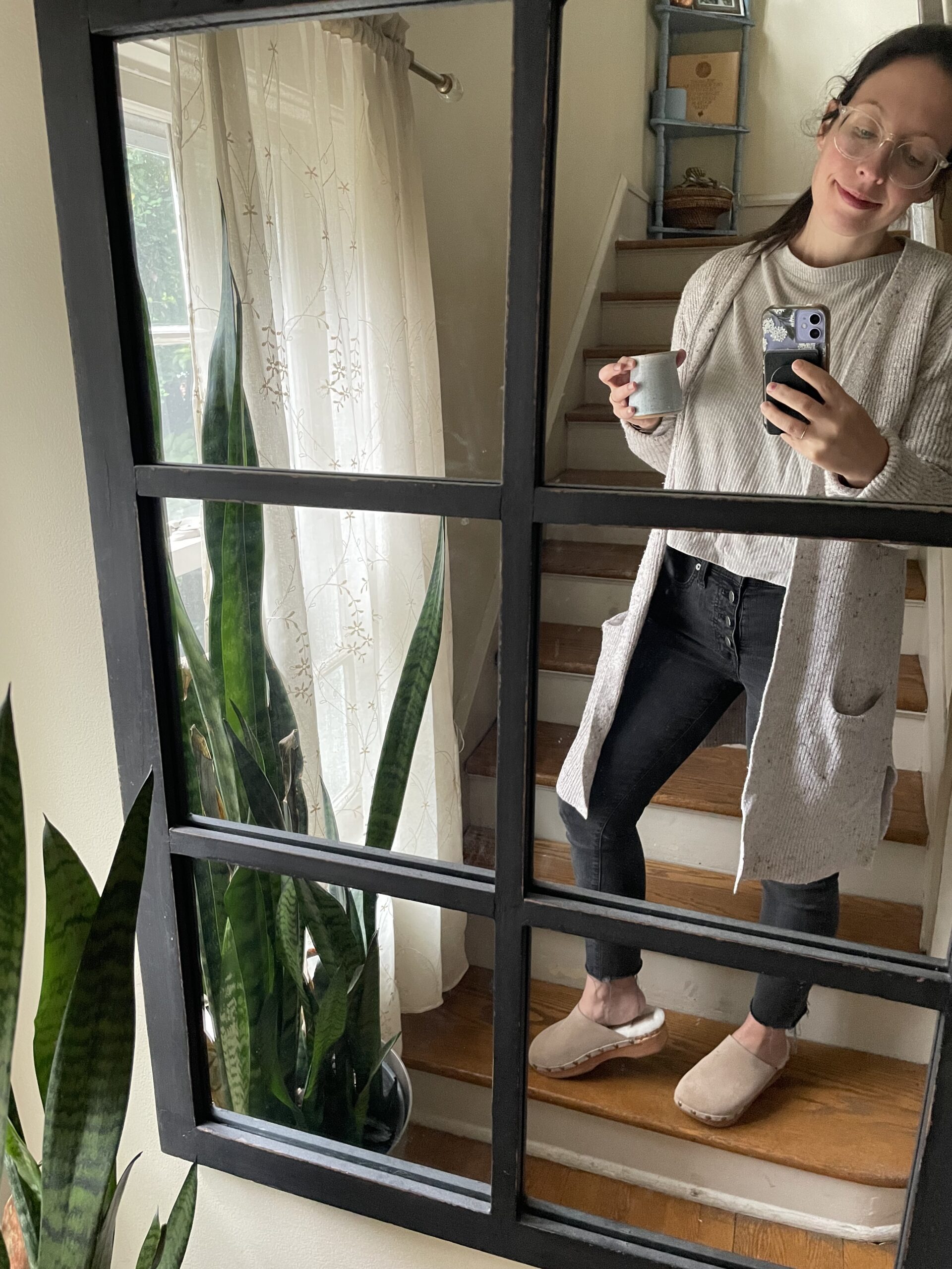 A mirror selfie modelling Beek clogs. 