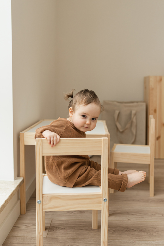 Toddler playing in nursery. Family concept.