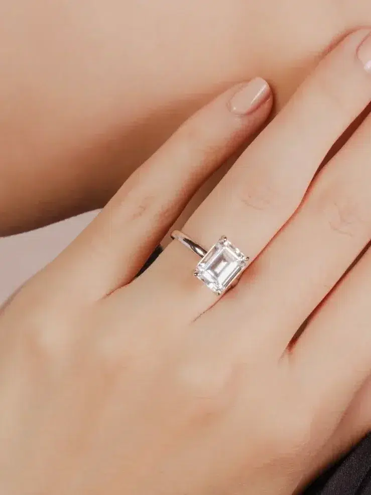 Close up of a moissanite ring on a model's hand from Gem & Co