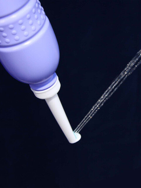 A Brondel Travel Bidet with water coming out.