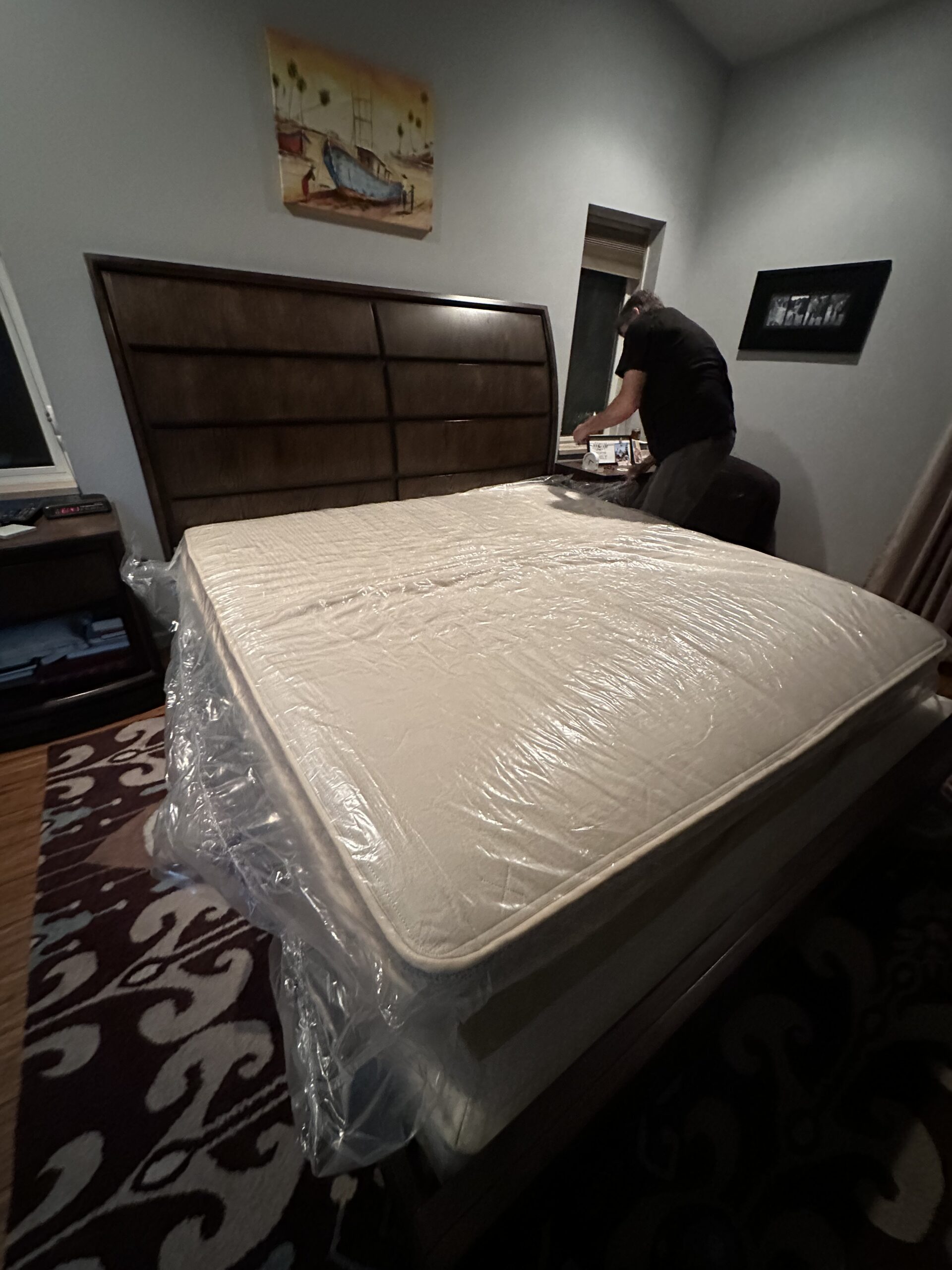 Setting up the Birch Luxe mattress on a bed frame. 