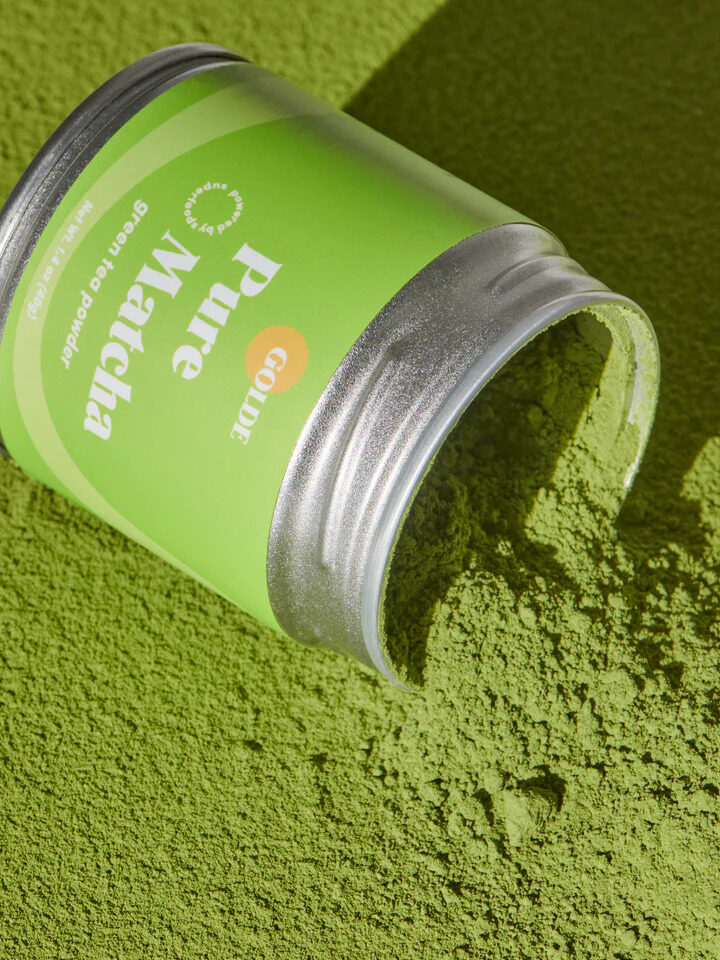 A tipped over canister of Golde's Pure Matcha. 