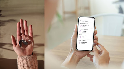 A person holds a key fob in one hand and a smartphone with a home security app interface in the other hand.