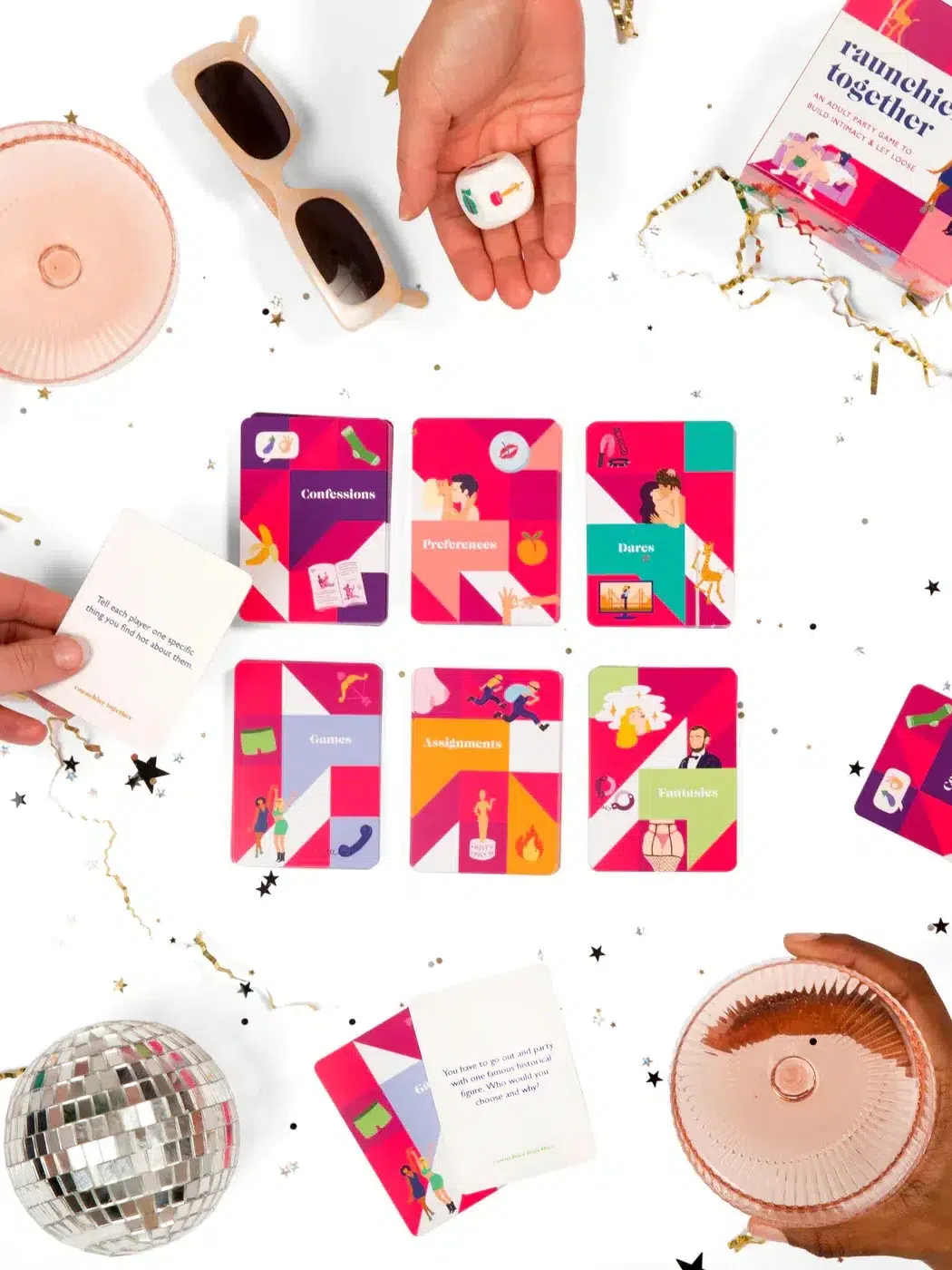 A group of people sitting around a table with cards and drinks.