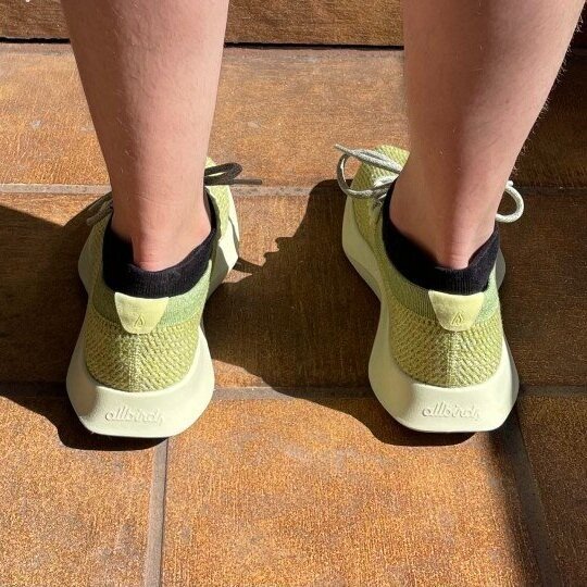 Close up shot of Allbird's Tree Dasher shoes in a highlighter green shade.