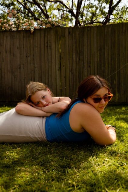 Best friend teenagers having fun on the grass.