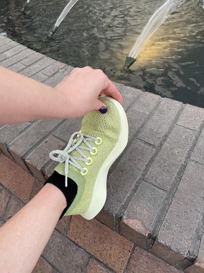 Close up shot of Allbird's Tree Dasher shoes in a highlighter green shade.