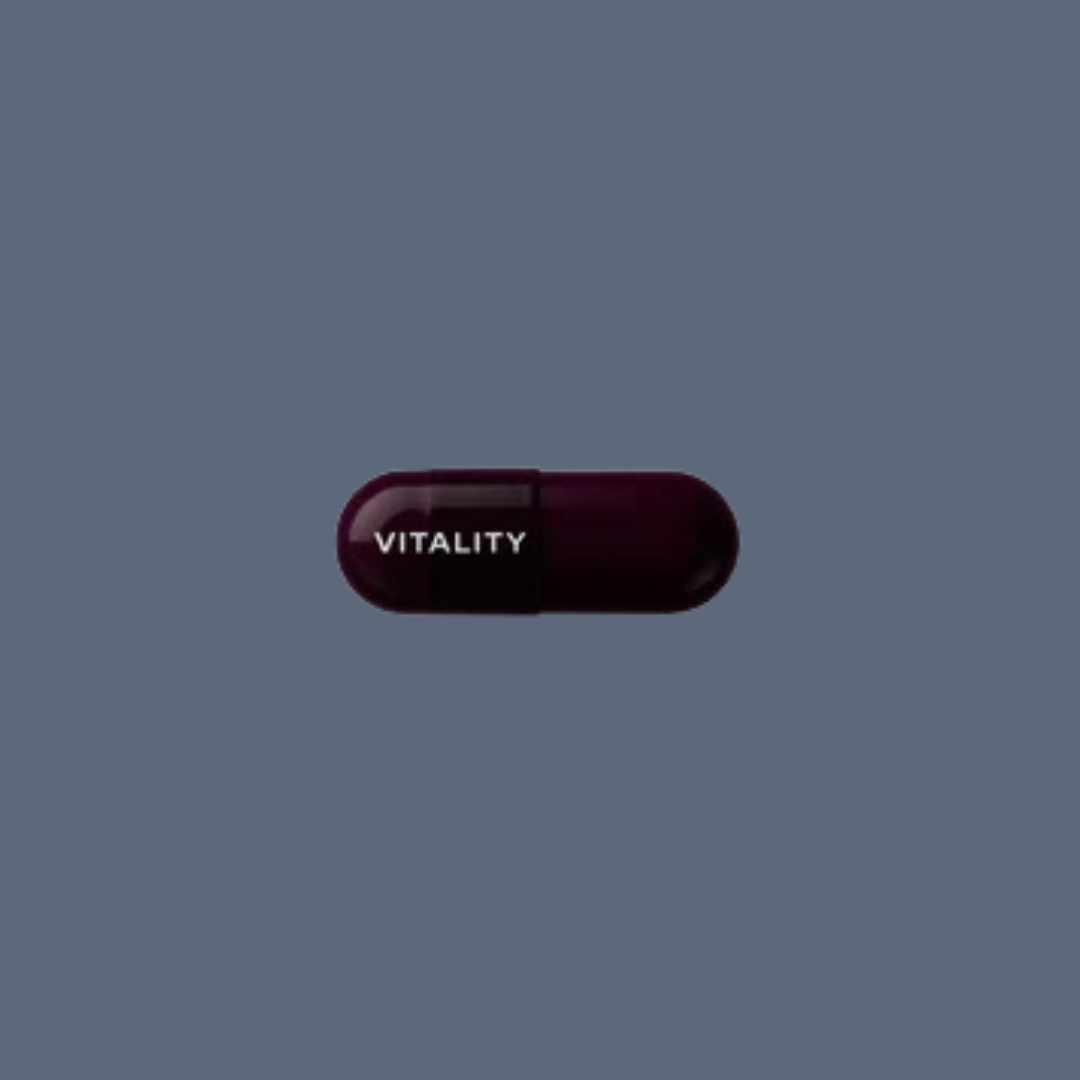 A dark purple capsule pill on a gray background with the word "VITALITY" printed in white on one half.
