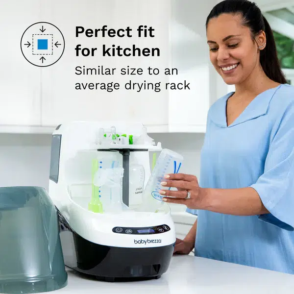 A person places a baby bottle in a compact bottle sterilizer labeled "babybrezza," with a caption highlighting its kitchen-friendly size.