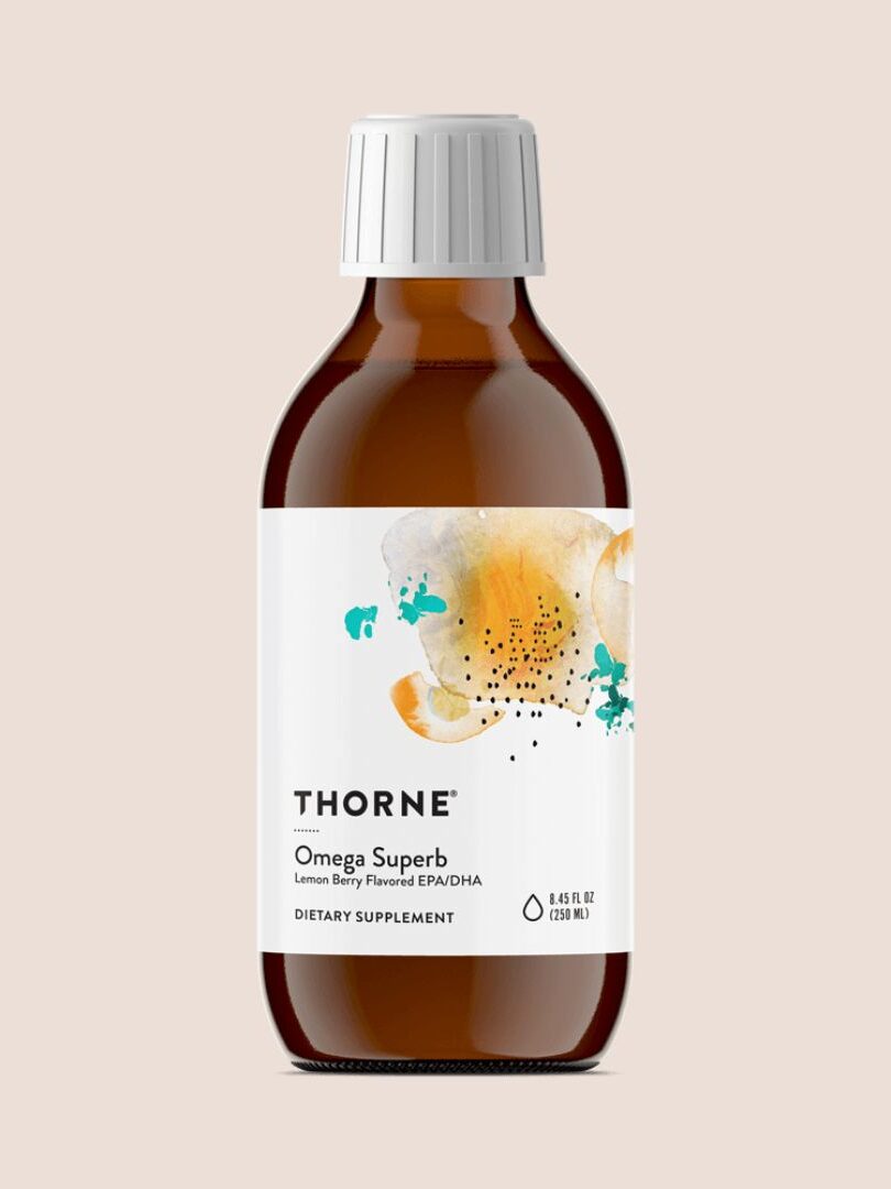 A brown bottle labeled "Thorne Omega Superb" with a white cap. The label includes a lemon berry flavor and indicates the product is a dietary supplement. The volume is noted as 6.8 fl oz (200 ml).