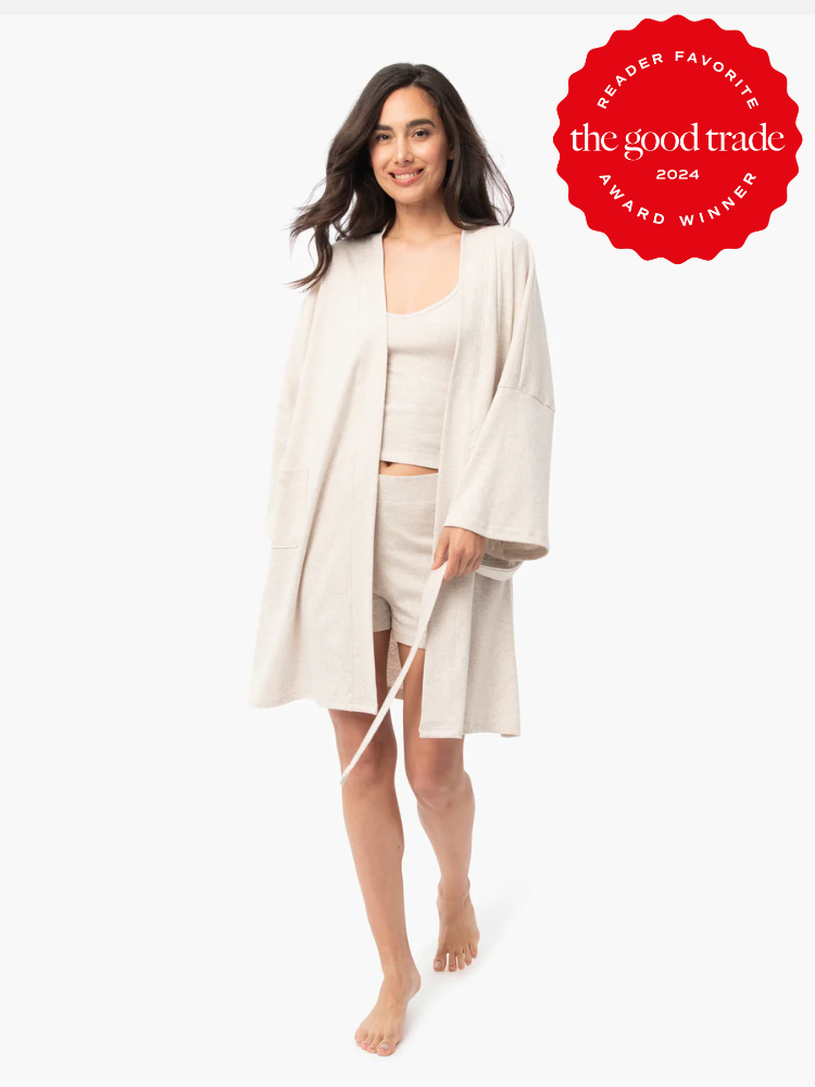 A model wearing a beige Under the Canopy robe. 