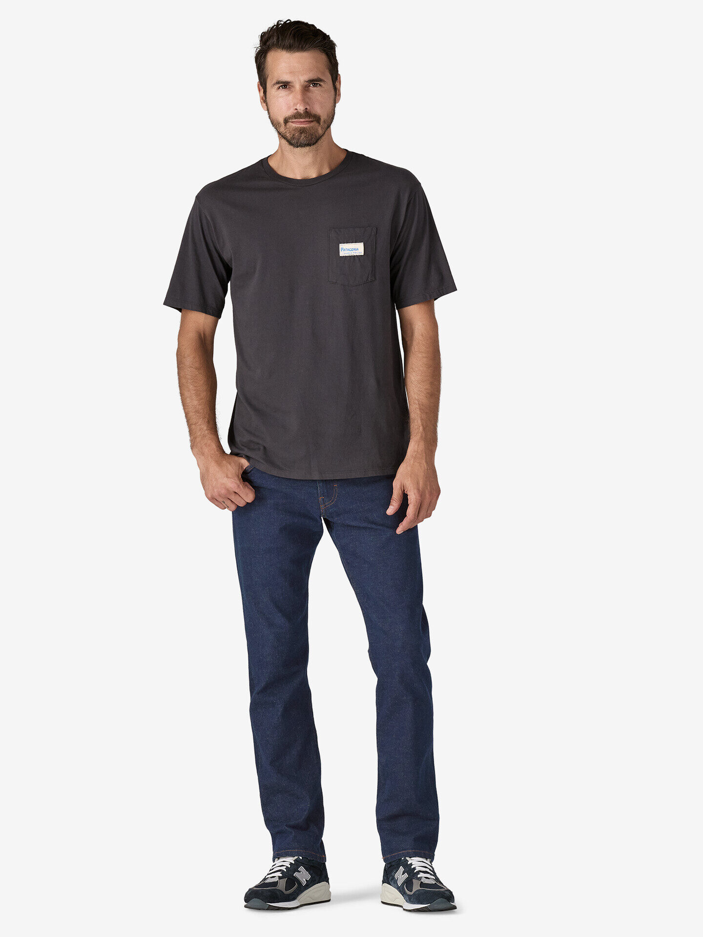 A model wearing dark wash Patagonia jeans.