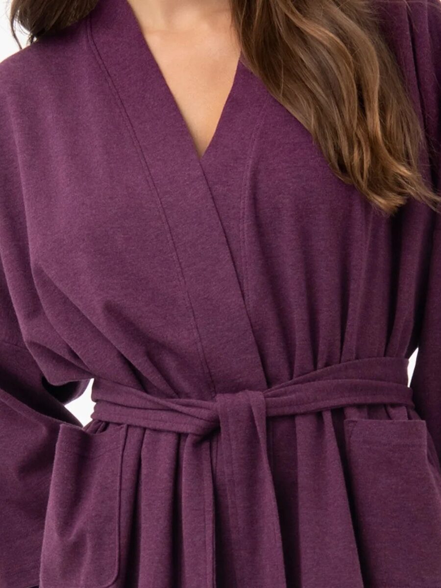 Close up of a model wearing a purple Under the Canopy robe. 