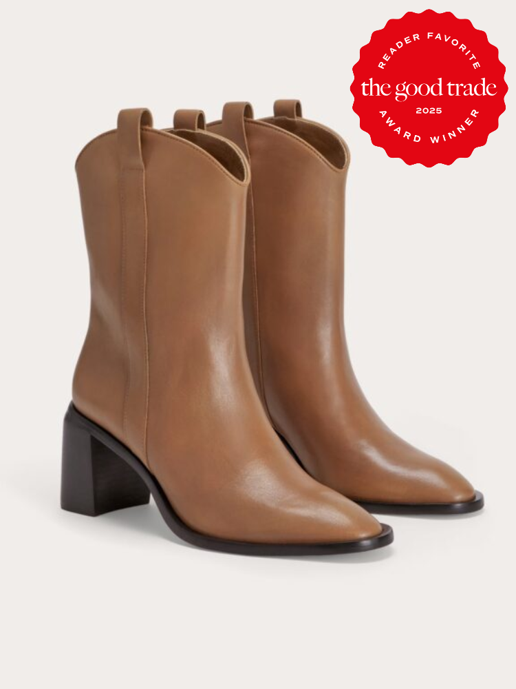 A pair of brown leather ankle boots with block heels. A red badge in the top right corner reads "Reader Favorite 2025, The Good Trade, Award Winner.