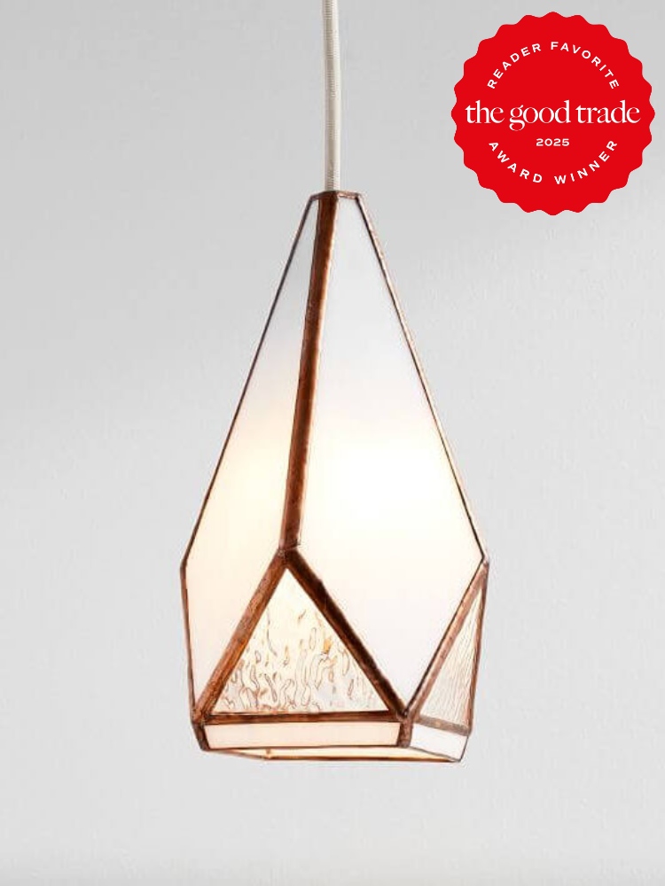 Geometric pendant light with a hexagonal design, featuring frosted and clear glass panels. A red "The Good Trade 2025 Reader Favorite Award Winner" badge is displayed in the upper right corner.