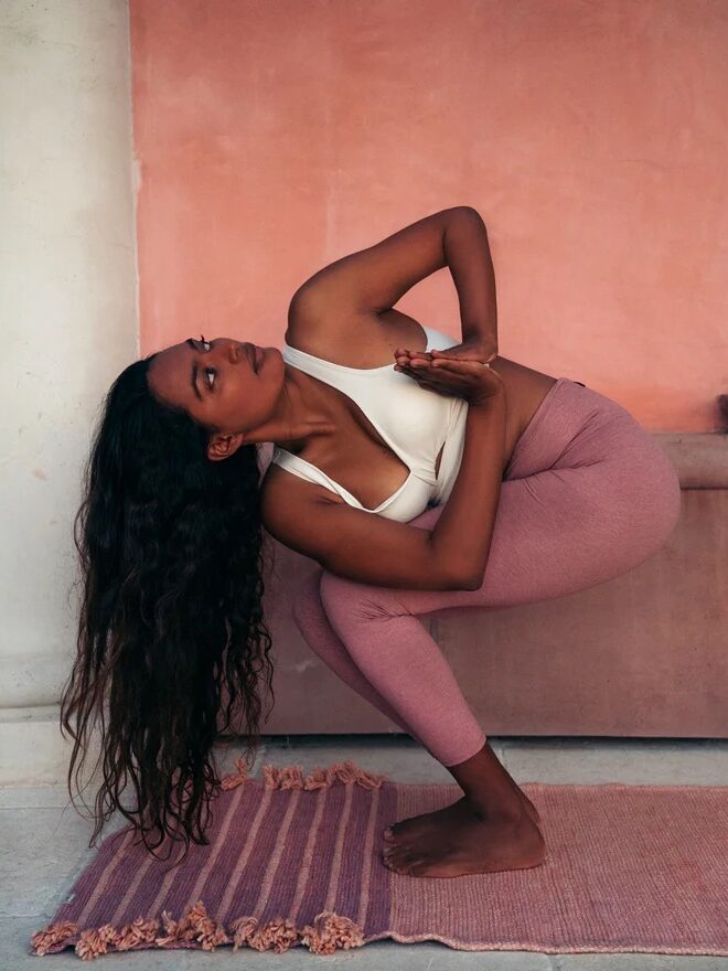 A model practicing yoga on a Bennd yoga mat. 