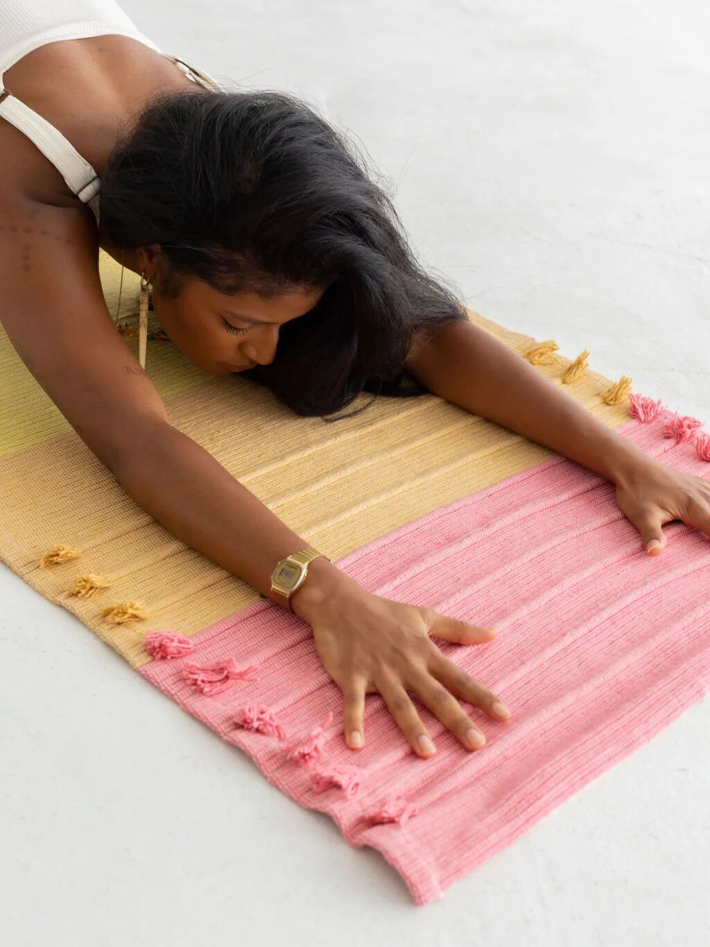 A model practicing on an Oko Living yoga mat. 
