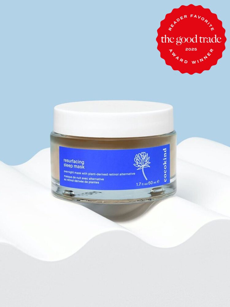 A jar of Cocokind Resurfacing Sleep Mask on a white surface against a light blue background, labeled as a 2025 Reader Favorite Award Winner by The Good Trade.