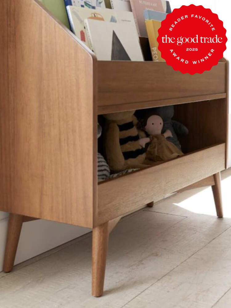 Wooden mid-century modern bookshelf with toys and books, featuring a "Reader Favorite - The Good Trade 2025 Award Winner" badge in the upper right corner.