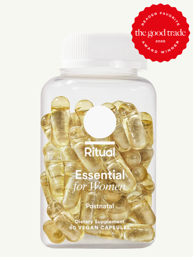 Transparent bottle of Ritual Essential for Women Postnatal vitamins with a red "Reader Favorite" award badge from The Good Trade, 2025, containing 60 vegan capsules.