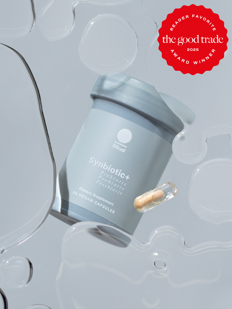 A jar of Synbiotic+ capsules is displayed against a background of abstract liquid shapes, alongside a red award badge from The Good Trade.