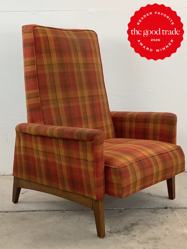 Plaid high-back chair with wooden legs against a white background, featuring a red "The Good Trade 2025 Reader Favorite Award Winner" badge in the corner.