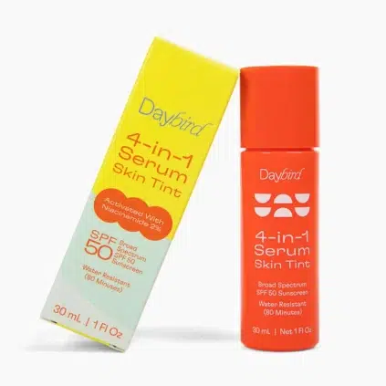 A yellow and orange Daybird 4-in-1 Serum Skin Tint box and bottle, featuring SPF 50, niacinamide 2%, water resistance, and 30 mL size.