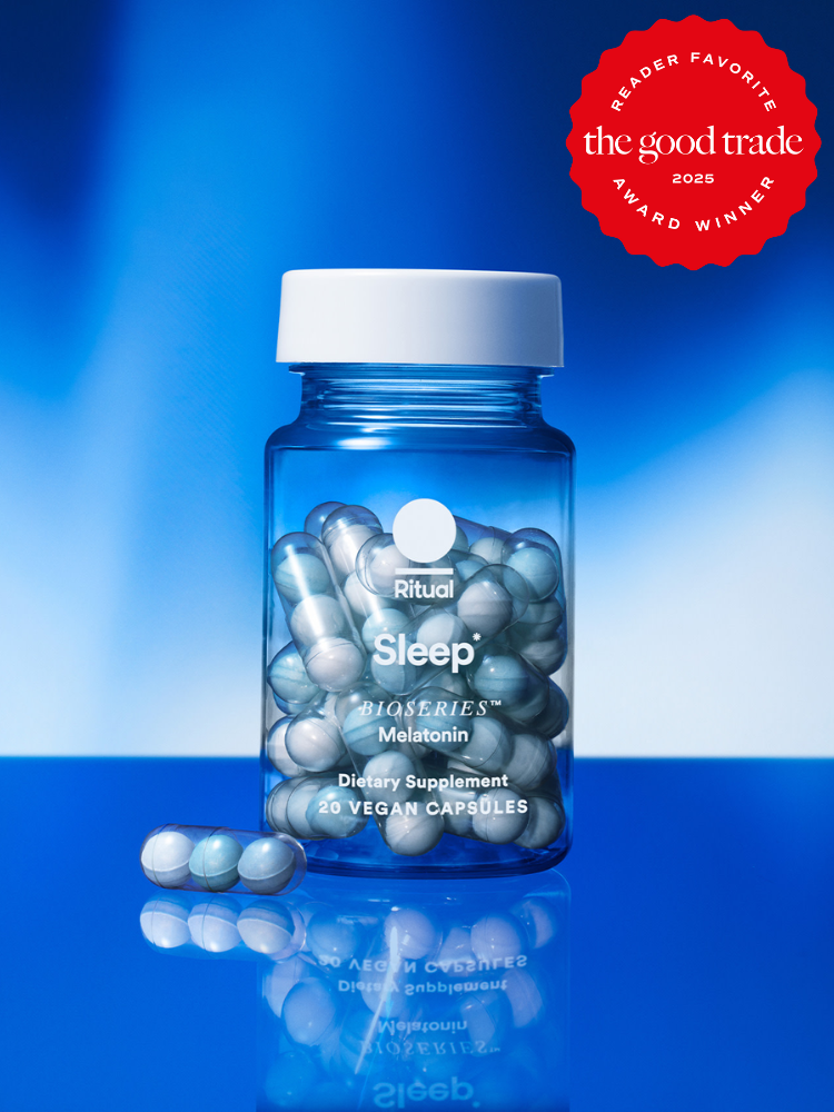 A bottle of Ritual Sleep dietary supplement capsules on a blue background, labeled as a 2025 award winner by The Good Trade.
