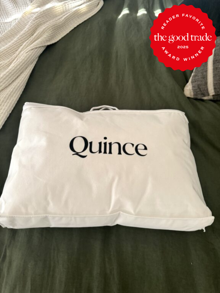 White Quince packaging on a dark green surface with a red award badge in the top right corner.