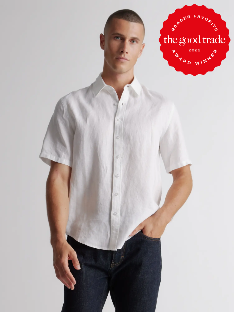 Person wearing a short-sleeve white button-up shirt and dark jeans, with an award badge saying "Reader Favorite, The Good Trade, Award Winner, 2025" in the top right corner.