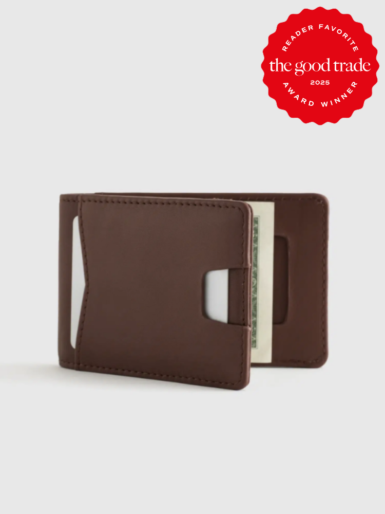 Brown leather wallet with a money clip holding bills, featuring a red "Reader Favorite Award Winner 2025" badge from The Good Trade.