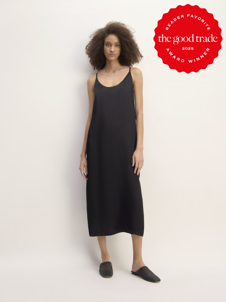 Person wearing a black sleeveless dress and black shoes stands against a plain background. A red badge reads "Reader Favorite Award Winner 2025 The Good Trade.