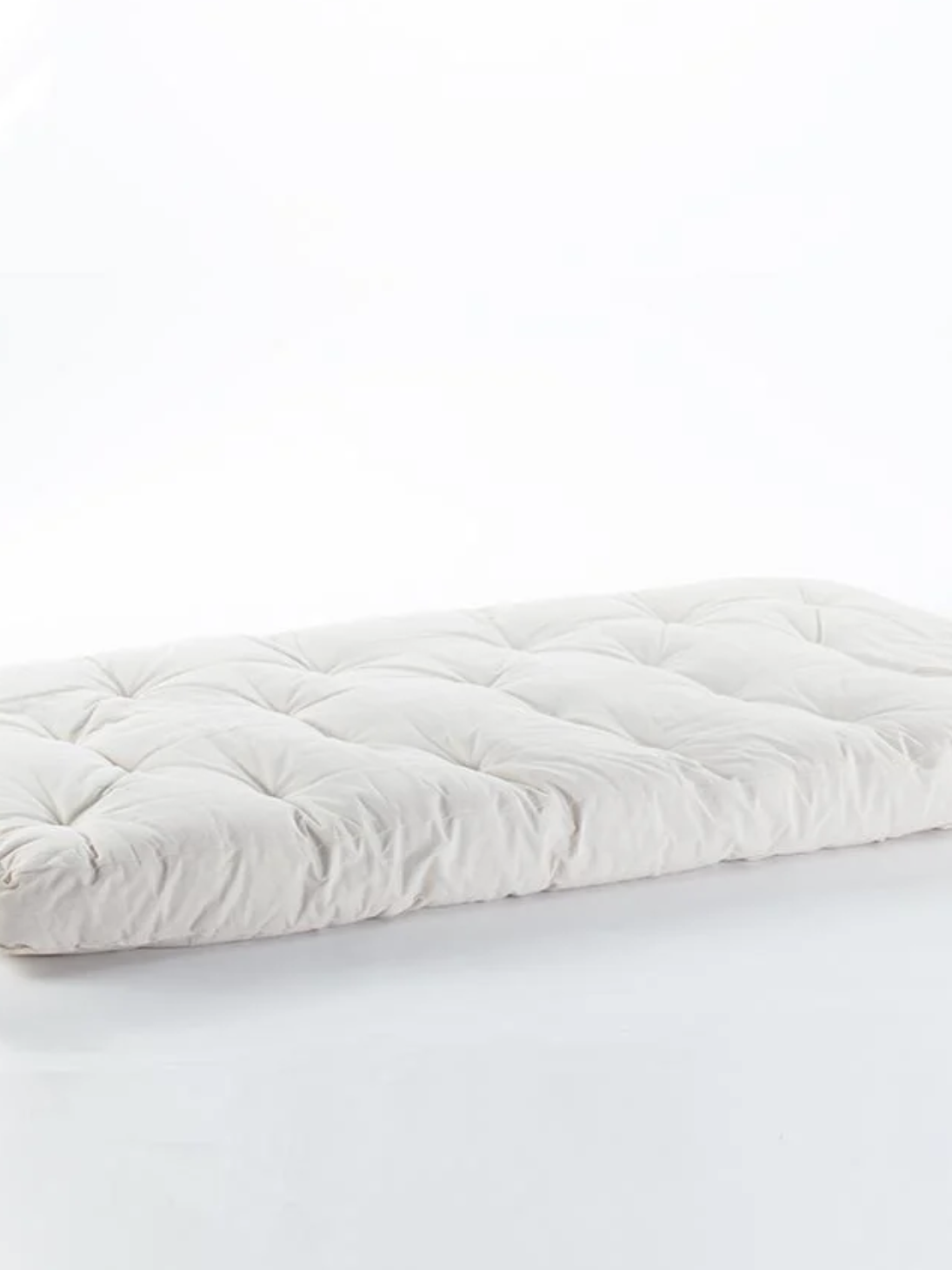 Rectangular white futon mattress with tufted stitching on a plain white background.