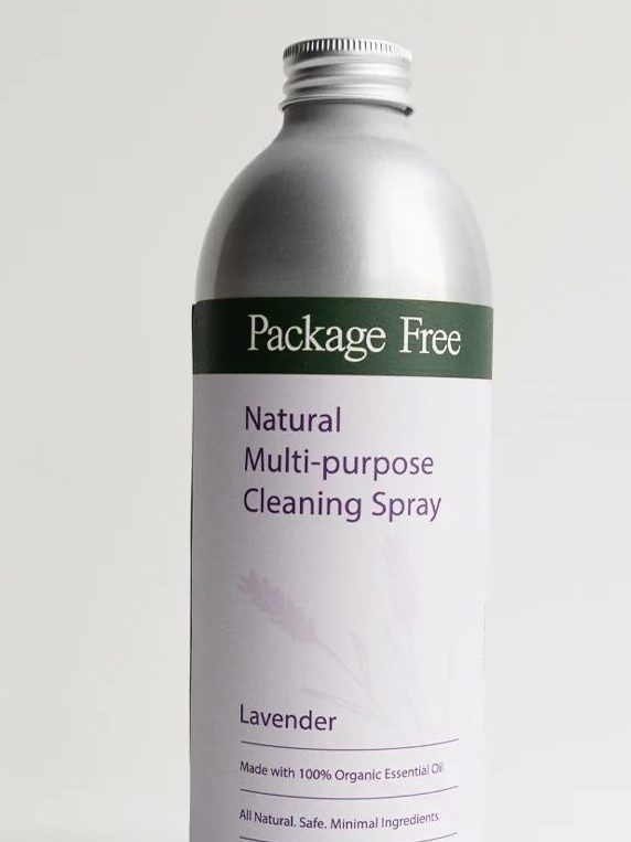 Silver bottle of "Package Free" Natural Multi-purpose Cleaning Spray with a lavender label, featuring EWG Verified logo. Contains organic essential oil. Made with all-natural ingredients.
