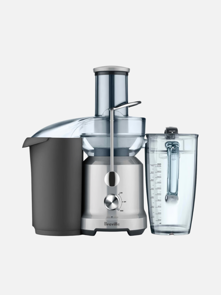Breville juicer with a stainless steel finish, including a pulp container and a clear measuring jug, set against a white background.
