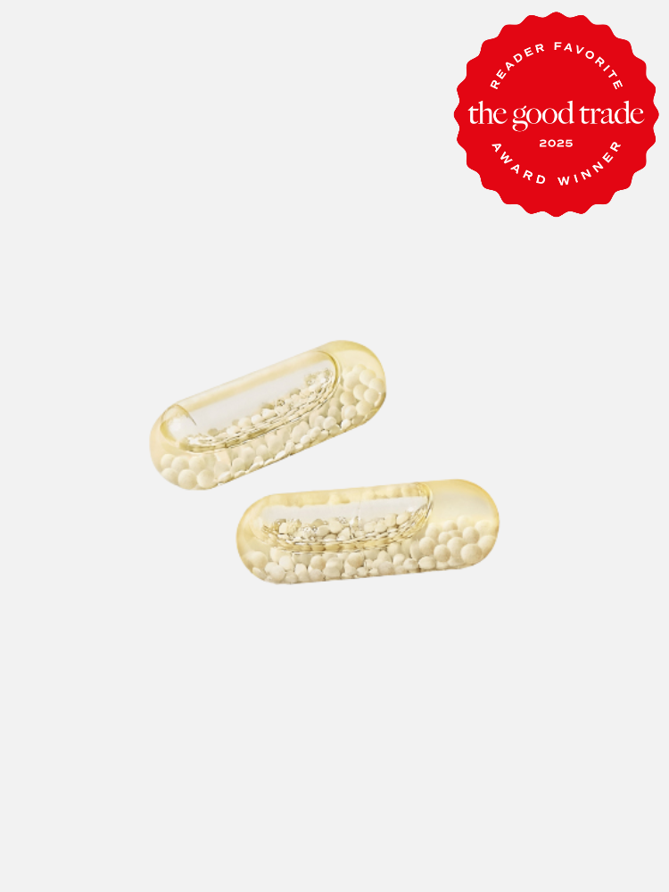 Two transparent capsules filled with white beads are placed against a light background. A red badge in the top-right corner reads "Reader Favorite The Good Trade Award Winner 2023.