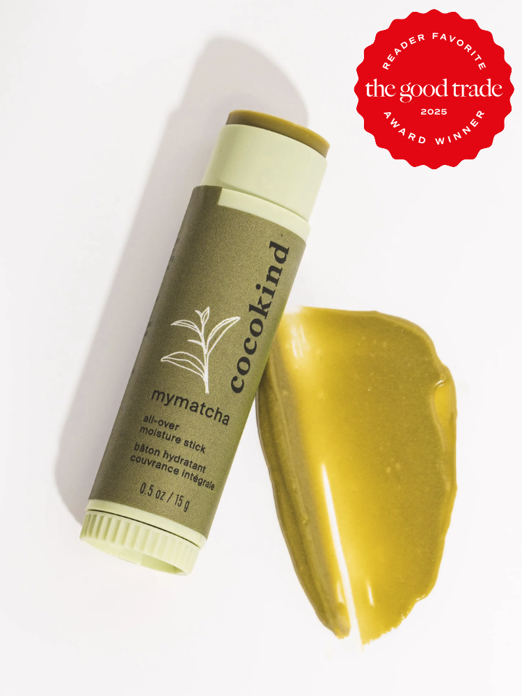 A Cocokind mymatcha all-over moisture stick is shown with a smear of its content beside it. A red badge indicates it as a 2025 Reader Favorite award winner from The Good Trade.