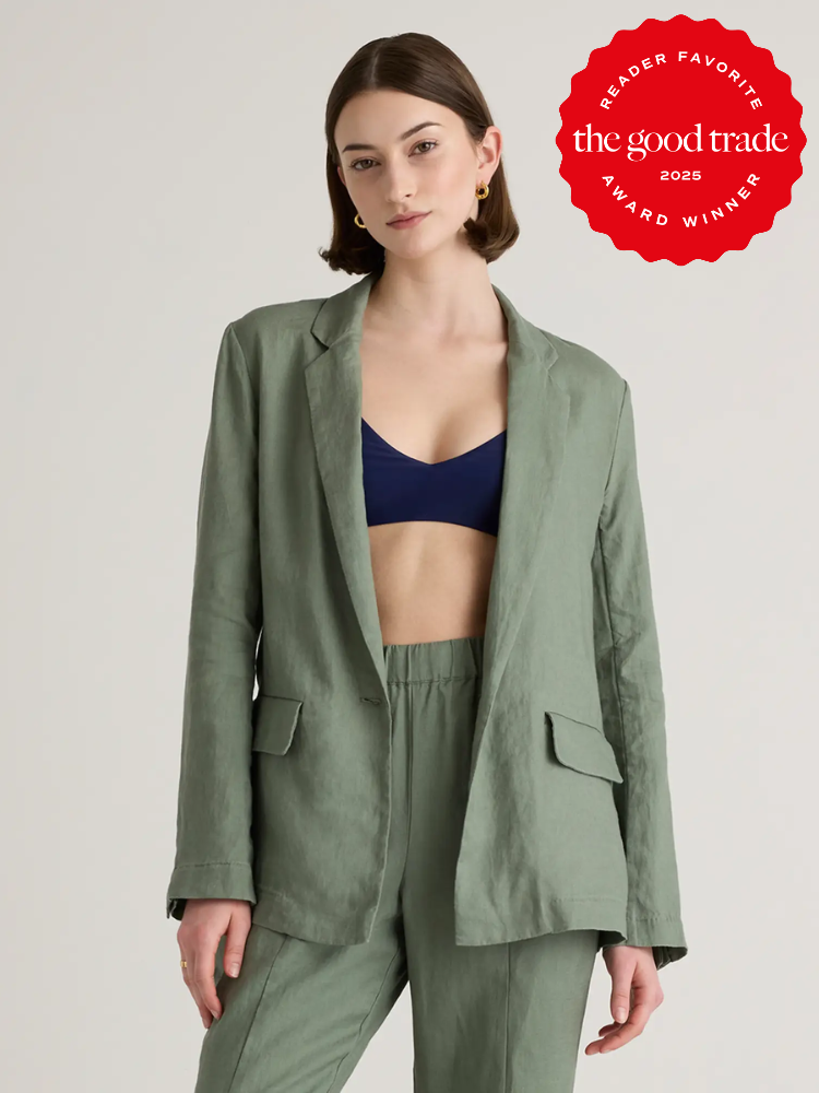 Person in a green suit jacket and pants poses, with a red award badge reading "The Good Trade Reader Favorite 2025" in the top right corner.