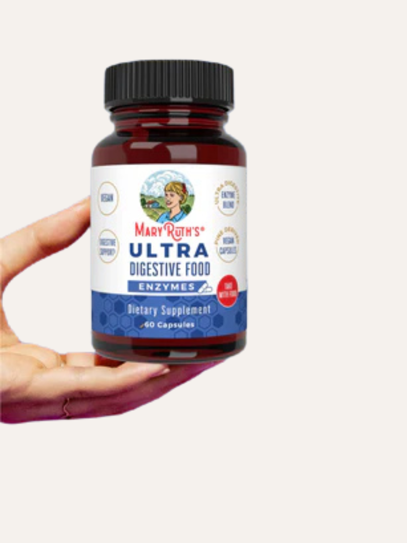 Hand holding a bottle of MaryRuth's Ultra Digestive Food Enzymes dietary supplement with 60 capsules.