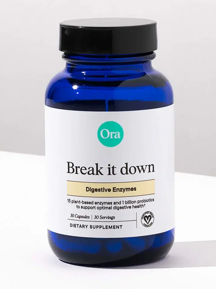 A blue bottle labeled "Ora Break it down," containing 30 capsules of digestive enzymes.