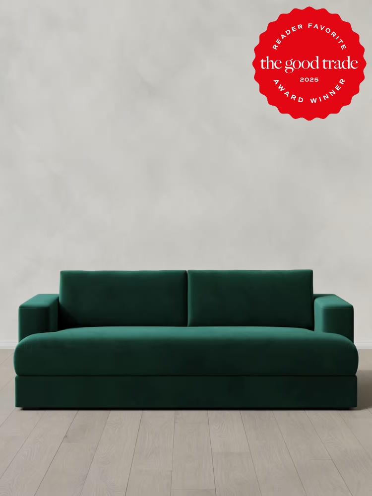 Emerald green sofa against a plain background. Red award badge in the top right corner reads "Reader Favorite, the good trade, 2025 Award Winner.