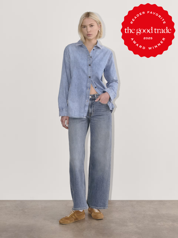 Person in a denim shirt and wide-leg jeans stands against a white background. A red badge in the top right corner reads "The Good Trade 2025 Reader Favorite Award Winner.